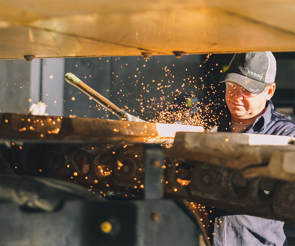 Firefighters sitting together on the tailgate of a fire truck